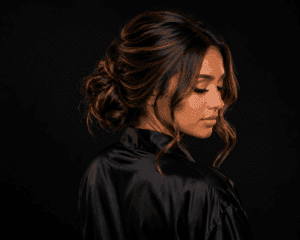 Luxury bridal hair updo in Winnipeg featuring modern glam hairstyling, textured low bun, bridal beauty hair services, and wedding hairstylist expertise by The Beauty Box by Sheriff x GlamGoRound