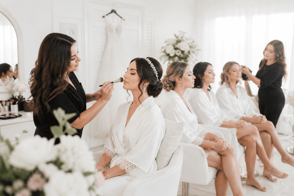 “Bridal makeup Winnipeg – full bridal party getting ready with professional glam team”
